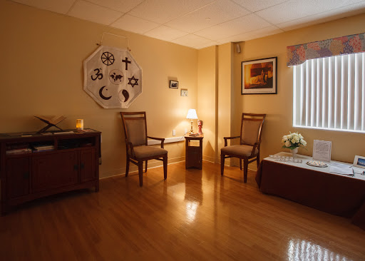 A serene waiting room with comfortable seating and soft lighting, designed to create a calming atmosphere.