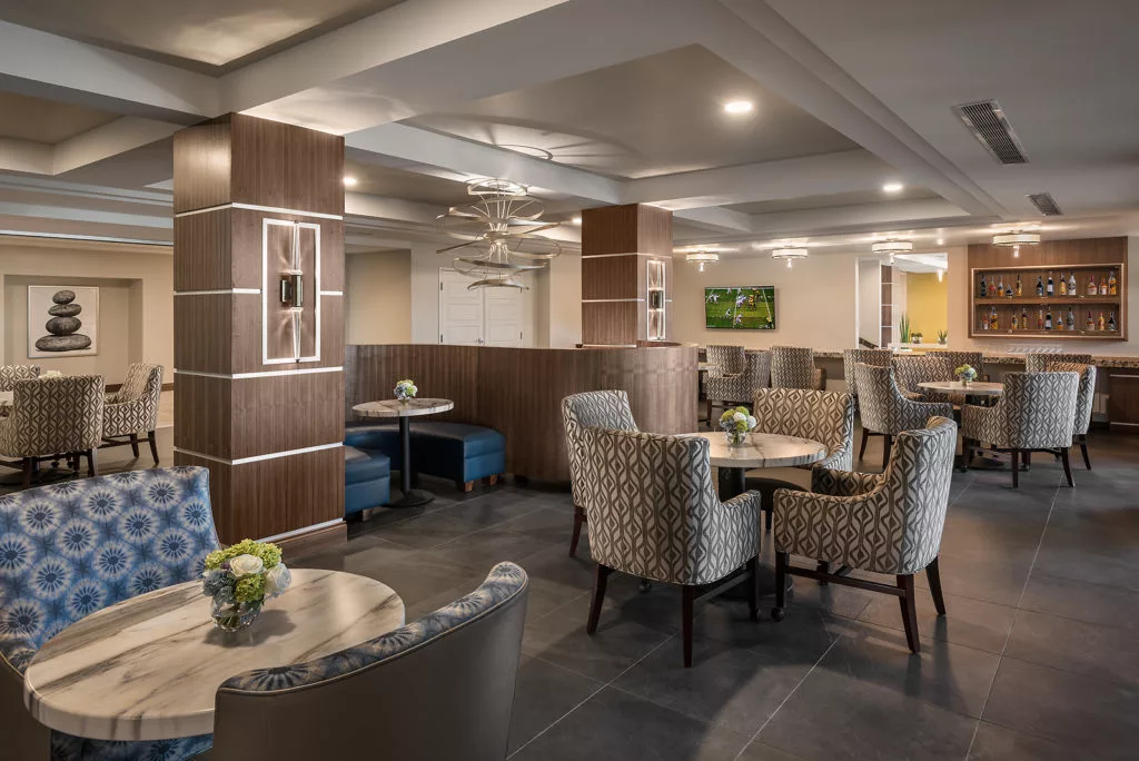 A modern hotel lounge with comfortable seating and elegant decor.