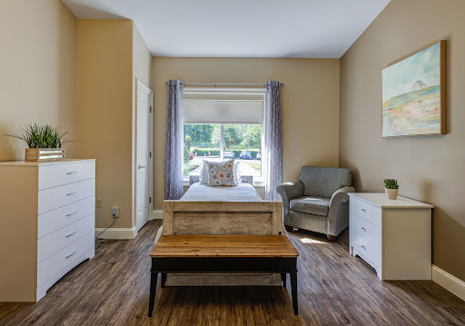 A cozy and well-lit bedroom featuring modern furniture and a welcoming atmosphere.