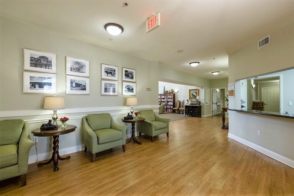 A well-lit lobby area with comfortable seating and decor.