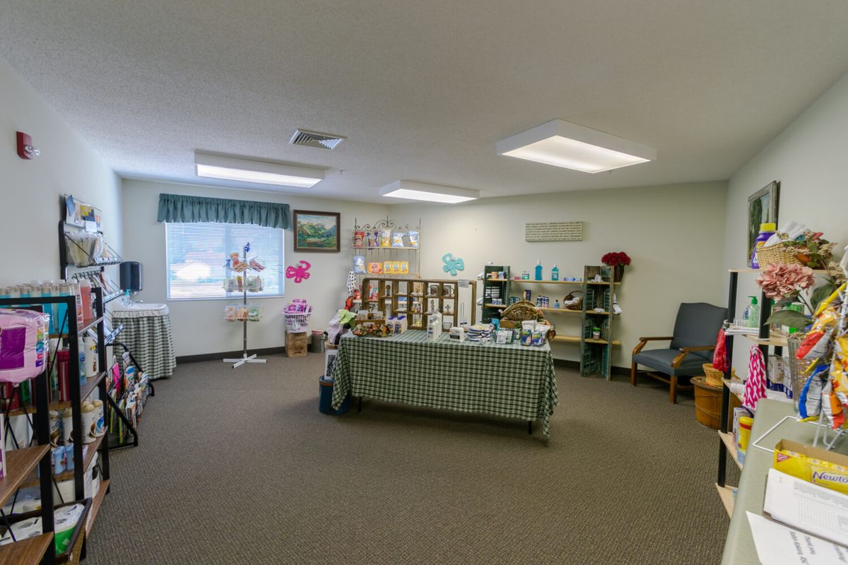 An interior view of a room with shelves and furniture displaying various items.