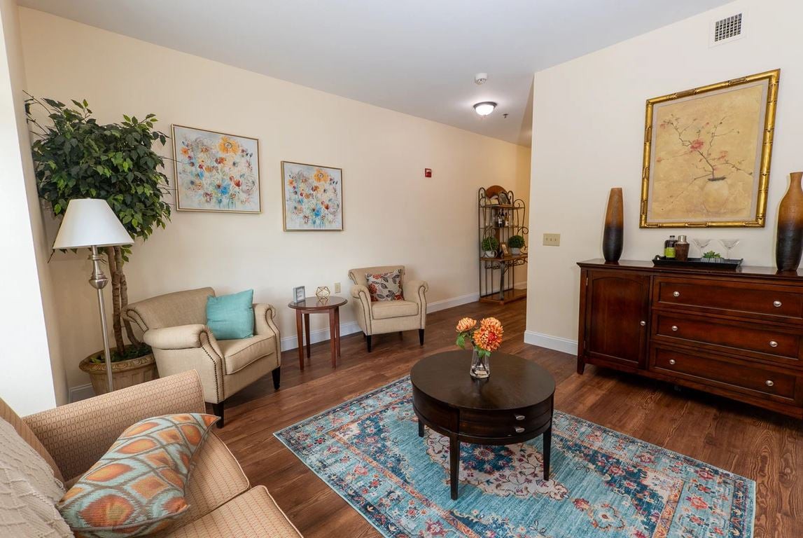 A cozy living room with stylish furniture and decorative elements.