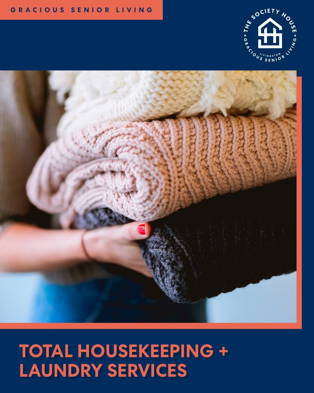 Person holding neatly folded blankets.