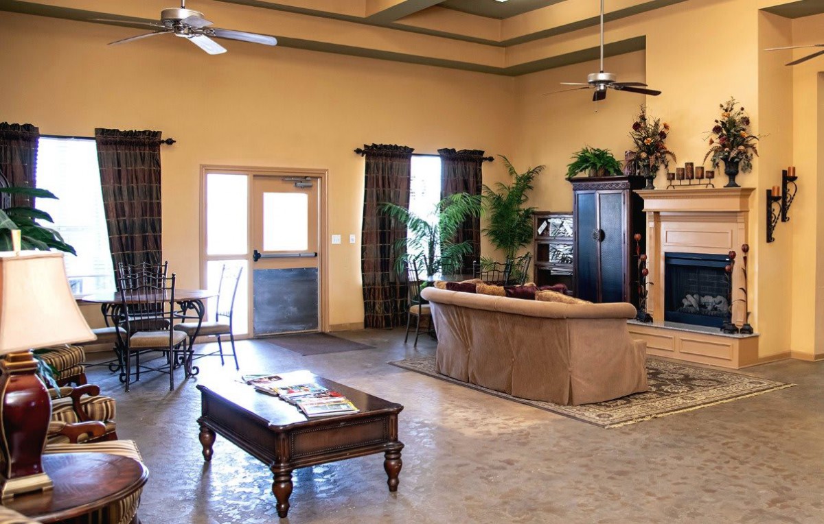 A spacious living room with comfortable seating and natural light.