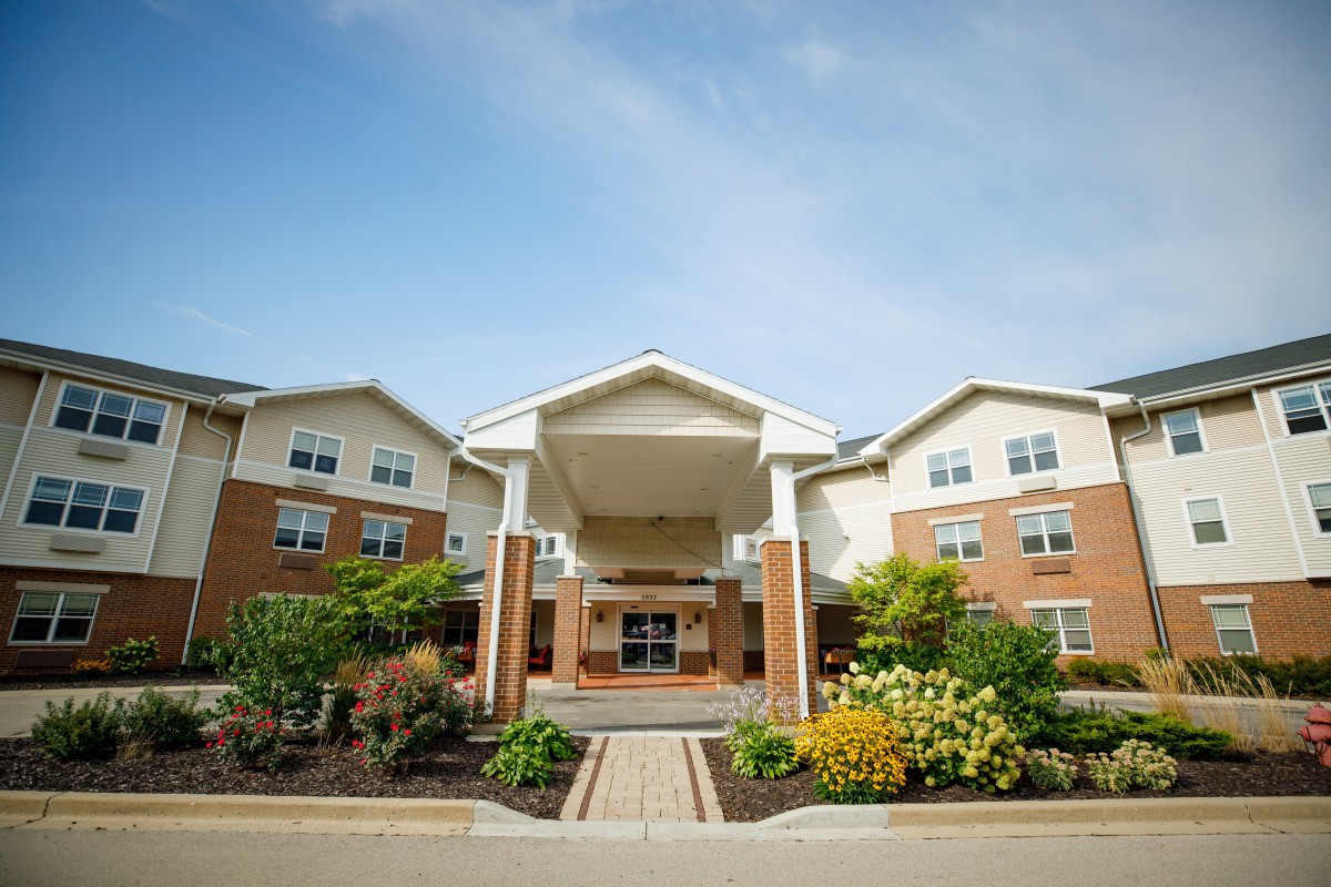 A well-maintained residential building with a welcoming entrance and landscaped surroundings.