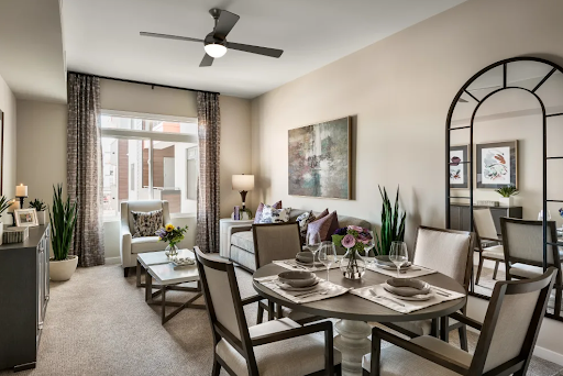 A beautifully decorated living and dining area featuring modern furnishings and a cozy atmosphere.