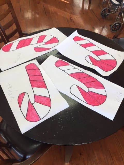 Colored candy cane cutouts on a table.