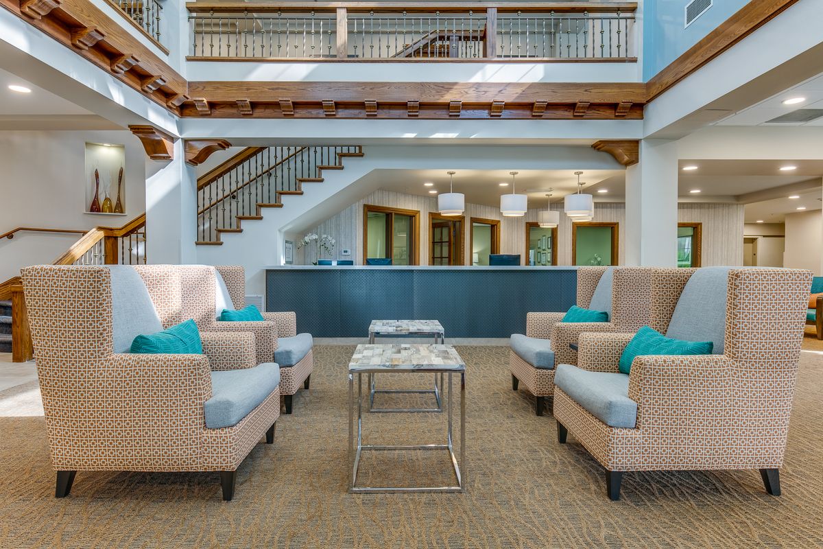 A modern lobby featuring comfortable seating and a stylish reception area.