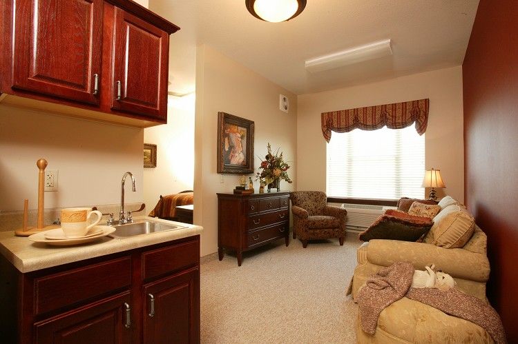 A cozy living room with warm lighting and comfortable seating.