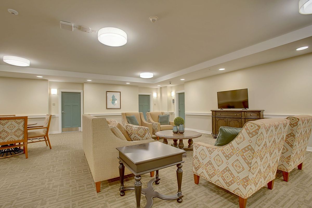 A cozy living room with comfortable seating and a television.