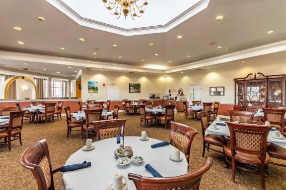 Spacious dining room with elegant decor and neatly arranged tables.