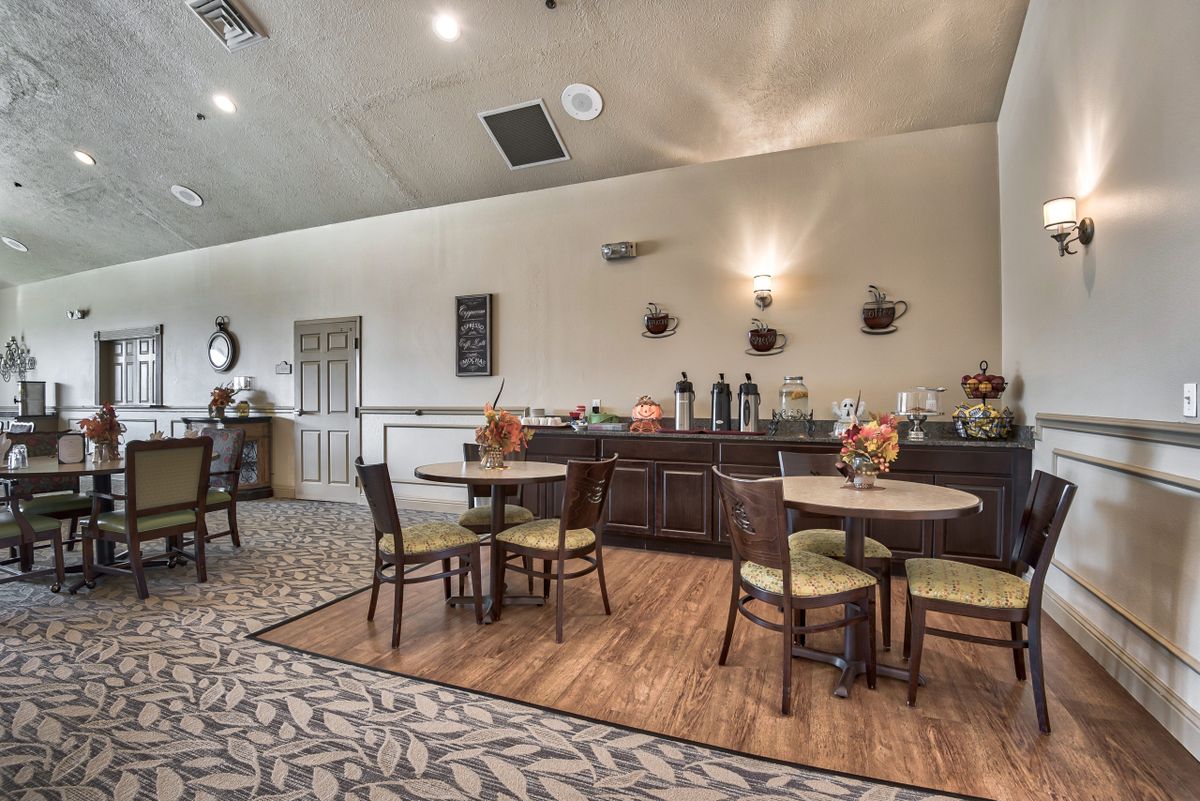 A cozy dining area with a buffet setup and stylish decor.