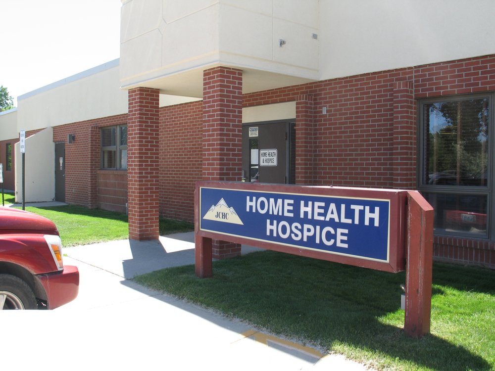 A building with a sign for Home Health Hospice.