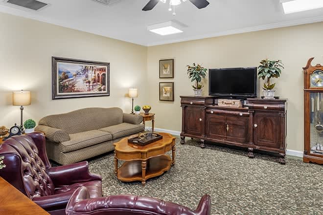 A cozy living room with comfortable seating and elegant decor.