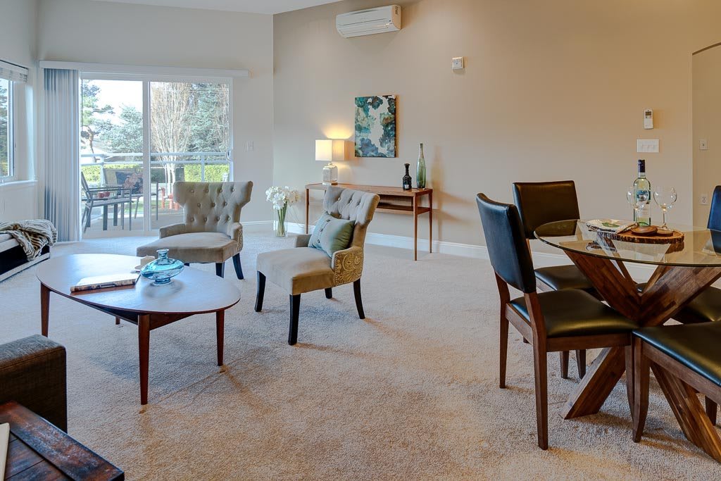 A modern living room with comfortable seating and stylish decor.
