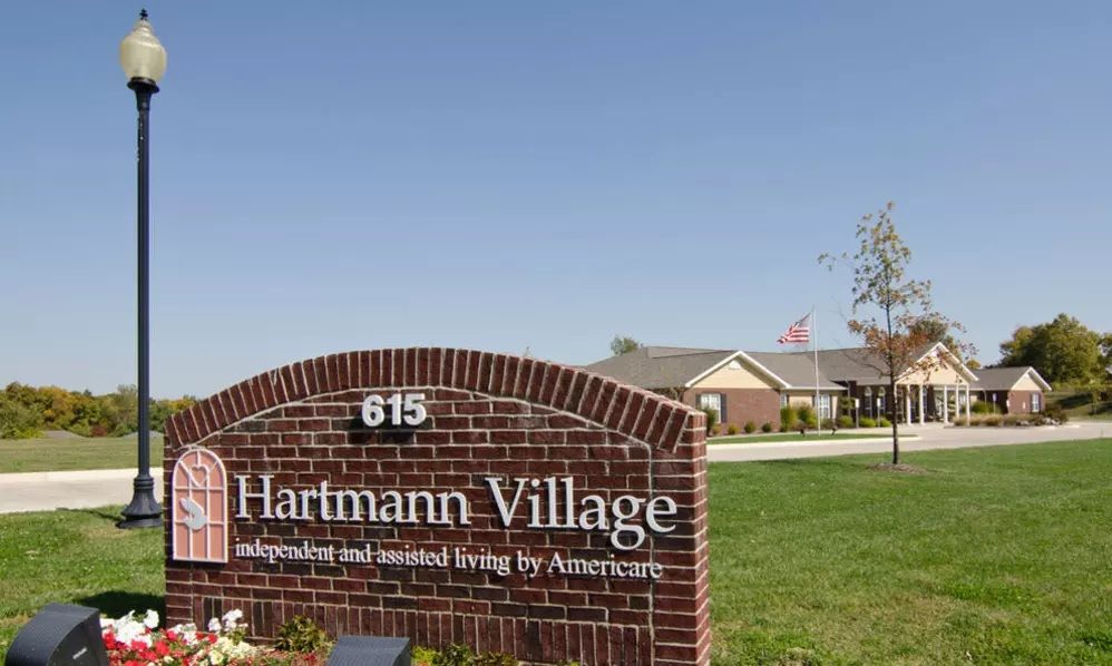 Entrance sign for Hartmann Village, a retirement and assisted living community.