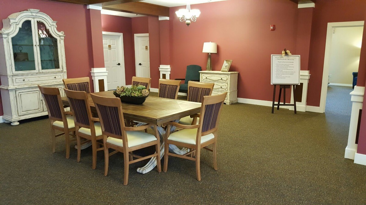A well-appointed dining area with a large table and elegant decor.