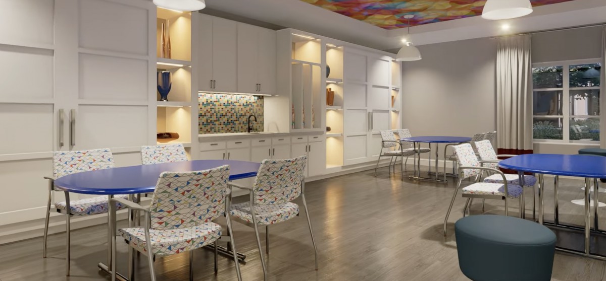 A modern kitchen and dining area with sleek furnishings and bright lighting.