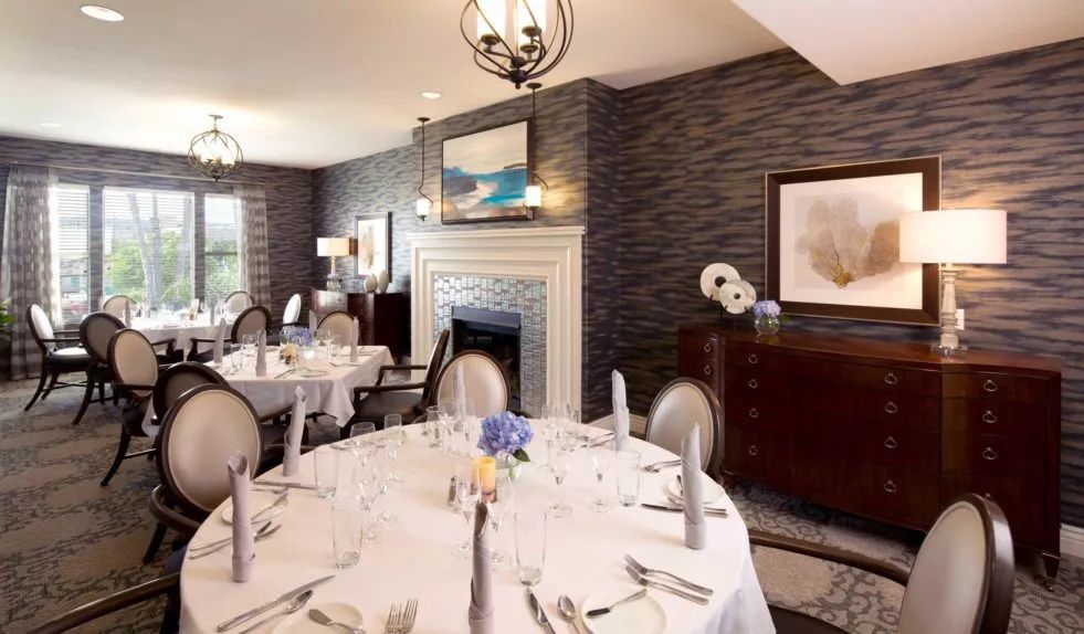 An elegant dining room with a formal table setting and stylish decor.