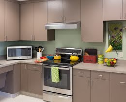 A modern kitchen with sleek cabinetry and stainless steel appliances.