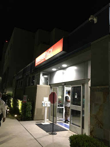 A brightly lit restaurant entrance at night.