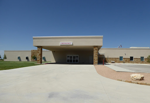 A view of a community center building under a clear blue sky.