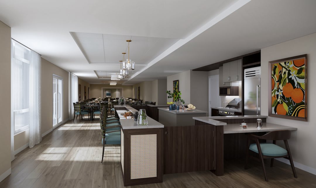 A modern kitchen with a sleek design, featuring a large island and an adjacent dining area.