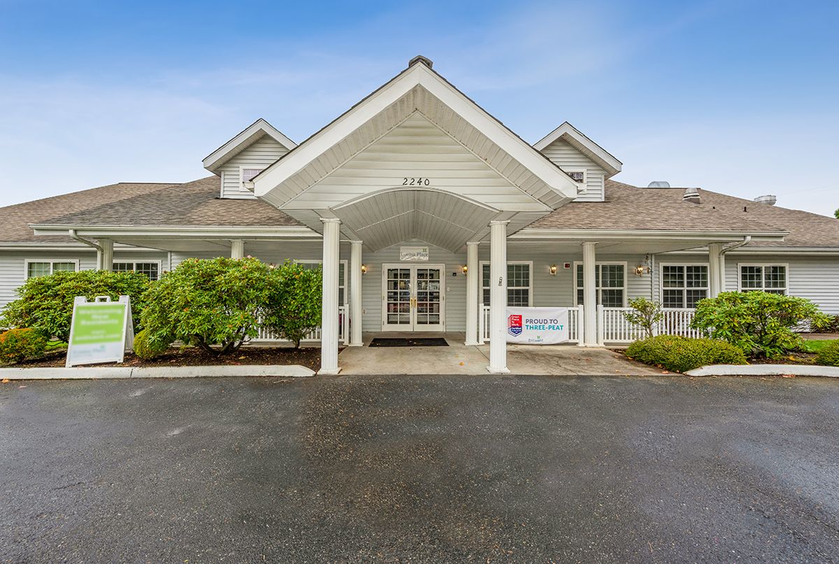 Front view of a residential building with a covered entrance.