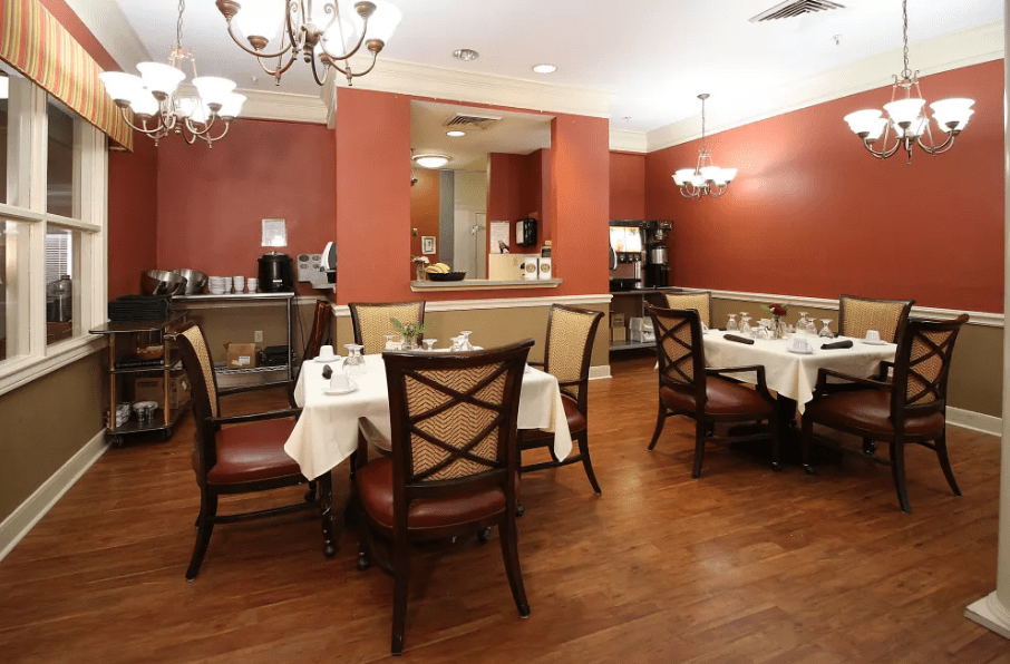 An elegant restaurant dining area with neatly arranged tables and chairs.