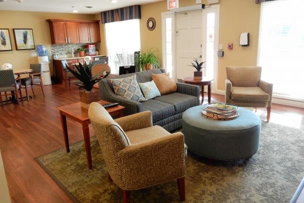 A cozy living room with comfortable seating and tasteful decorations.