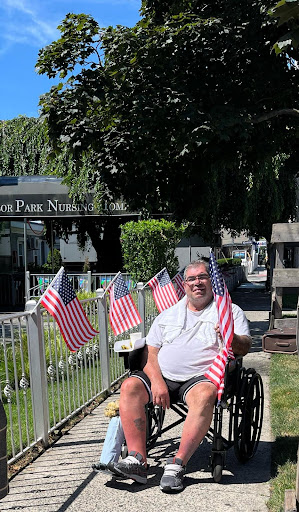 A joyful moment in the park, celebrating community and patriotism.