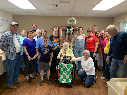 A joyful gathering of family and friends celebrating a special occasion together.