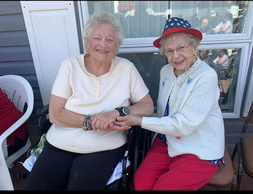 Two joyful friends sharing a moment together on a sunny day.