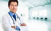 A confident doctor standing in a hospital setting.