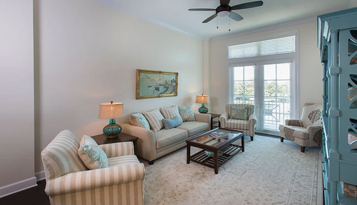 A cozy and well-lit living room with comfortable seating and tasteful decor.