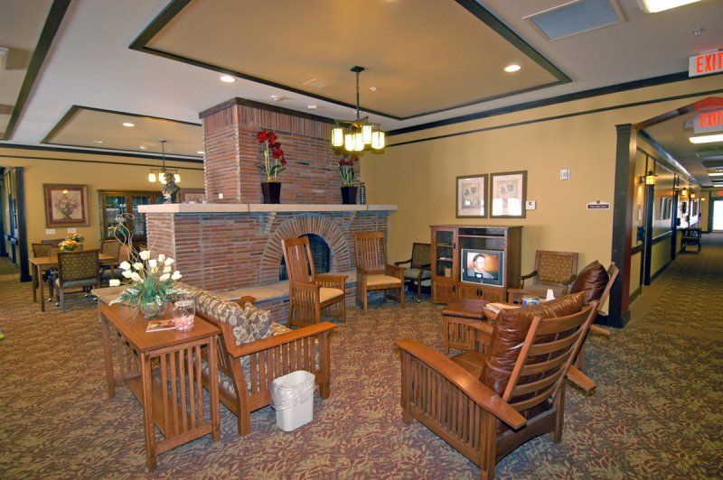 A cozy lobby with a fireplace and comfortable seating arrangement.
