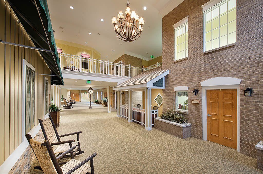 Spacious lobby area with a chandelier and comfortable seating.