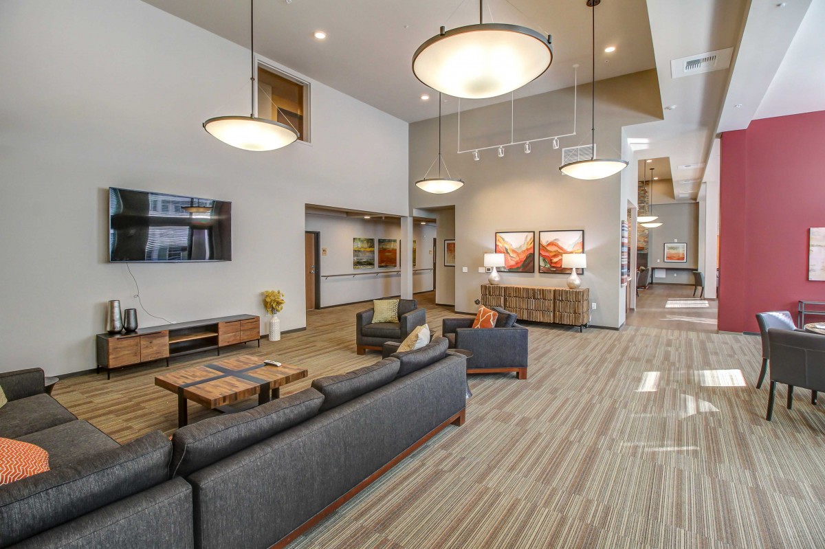 A modern lobby interior with comfortable seating and contemporary lighting.