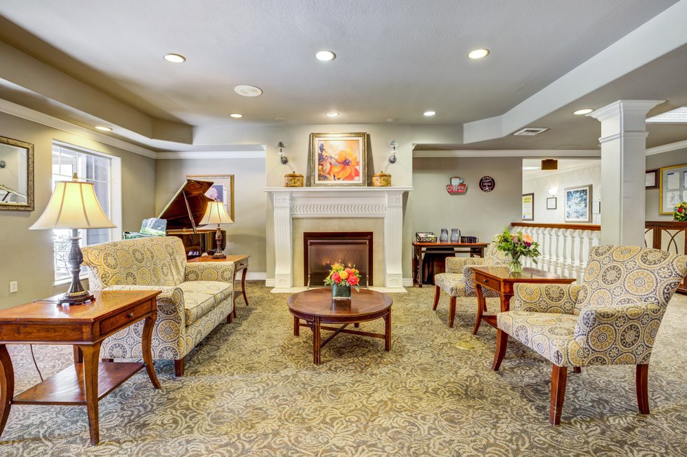 Elegant living room with a cozy fireplace and classic furnishings.