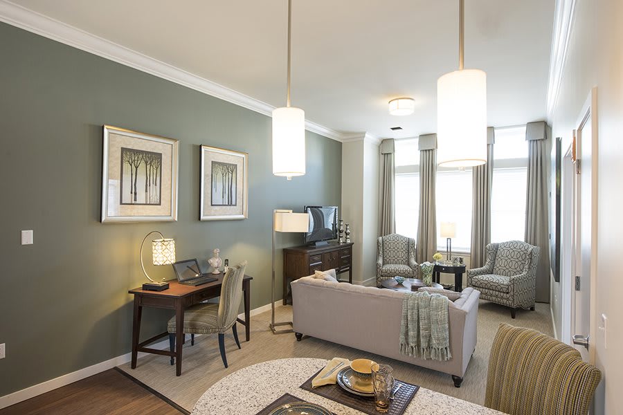 A modern and cozy living room with stylish decorations and furniture.