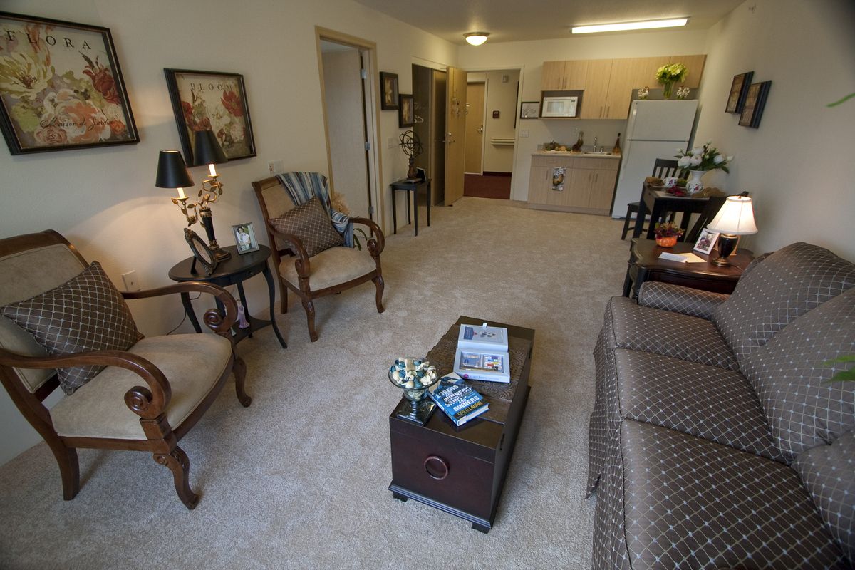 A cozy living room with classic furniture and decor in an apartment setting.