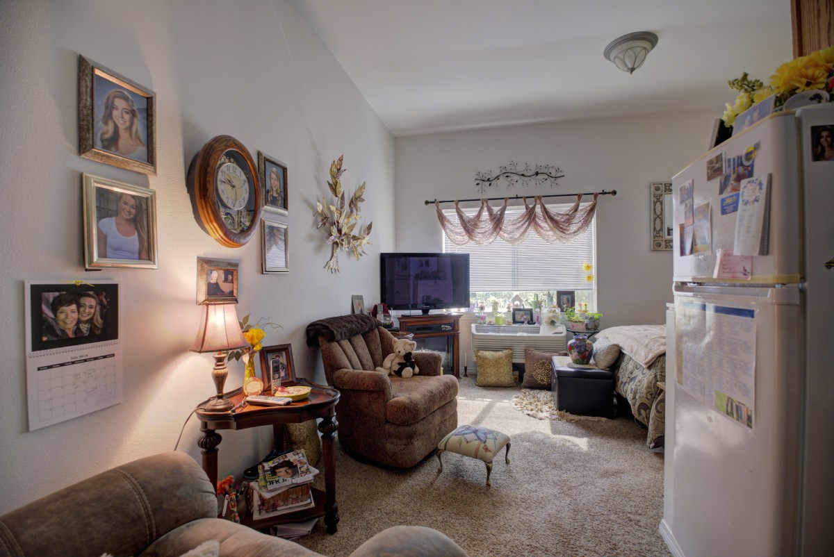 A cozy living room with comfortable seating and decorative elements.