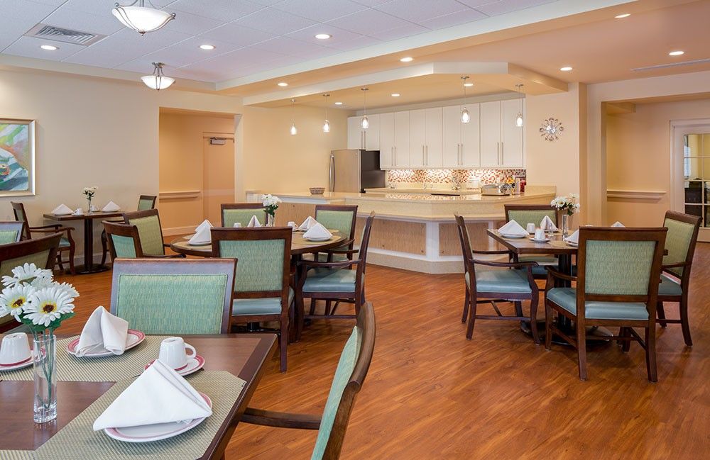 An elegant dining area with neatly arranged tables and chairs, ready for guests.