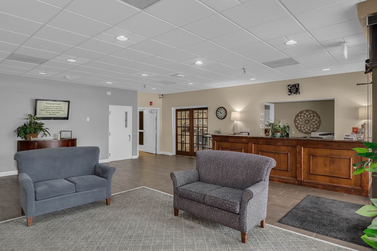 A welcoming lobby area with comfortable seating and a reception desk.