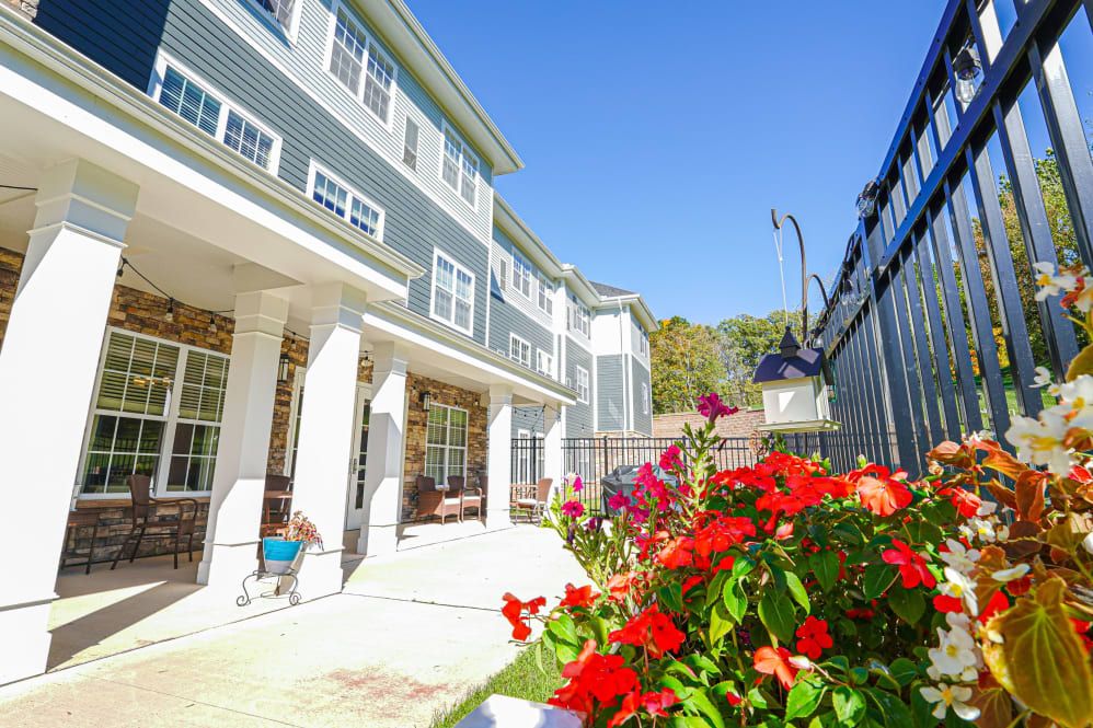 A sunny day at a residential building with a vibrant garden.