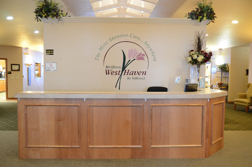 A welcoming reception area with a floral theme and wooden furniture.