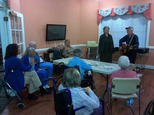 A music performance engaging senior citizens in a community center.