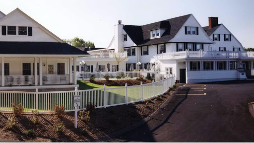 A picturesque residential house featuring a well-maintained exterior and landscaped yard.