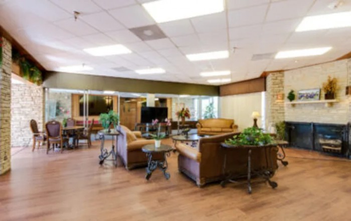 A cozy lobby area with comfortable seating and decorative plants.