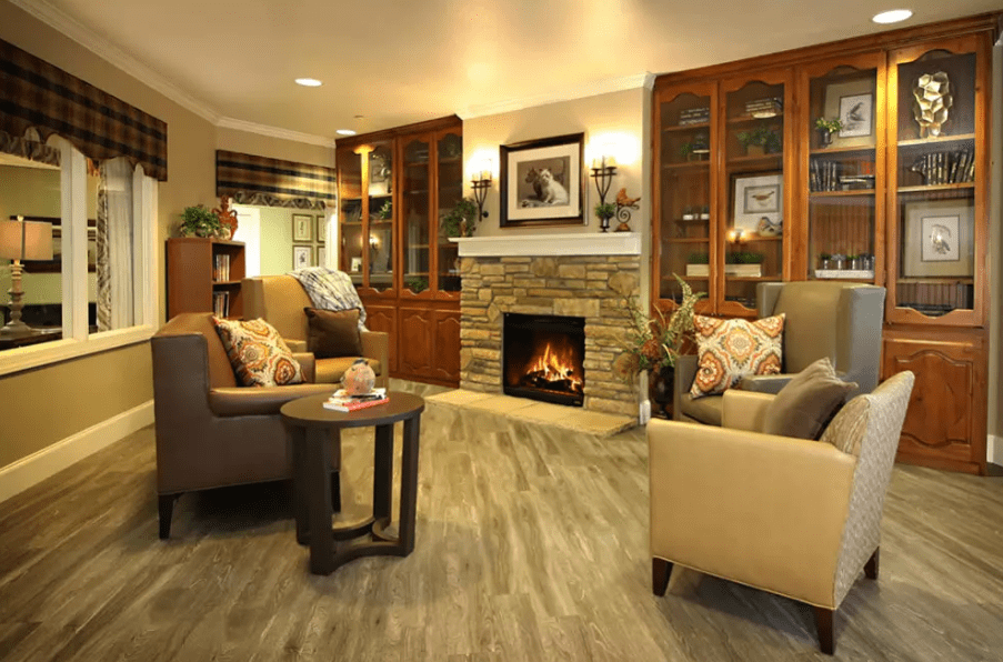 A cozy living room with a warm fireplace and comfortable seating.
